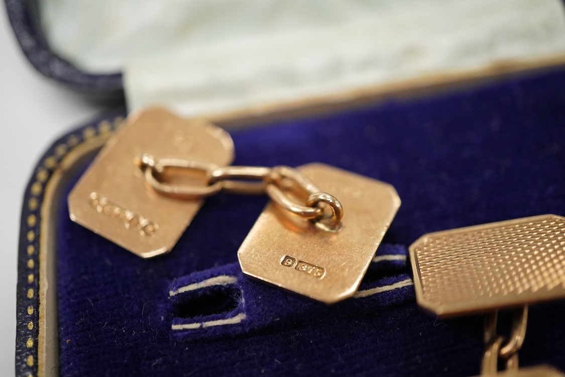 A pair of 1940's engine turned 9ct gold rectangular cufflinks by W. Wilkinson Ltd, 18mm, 6.5 grams, housed in a Mappin & Webb box.